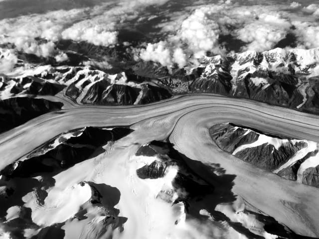 A wide landscape rendered in black and white