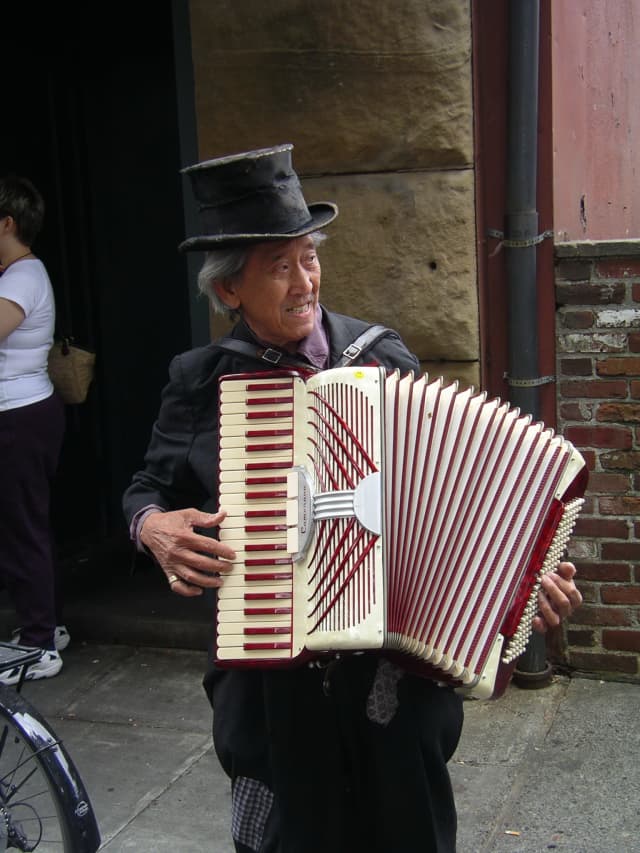 Accordian Man, a portrait photograph by Bob McNeil