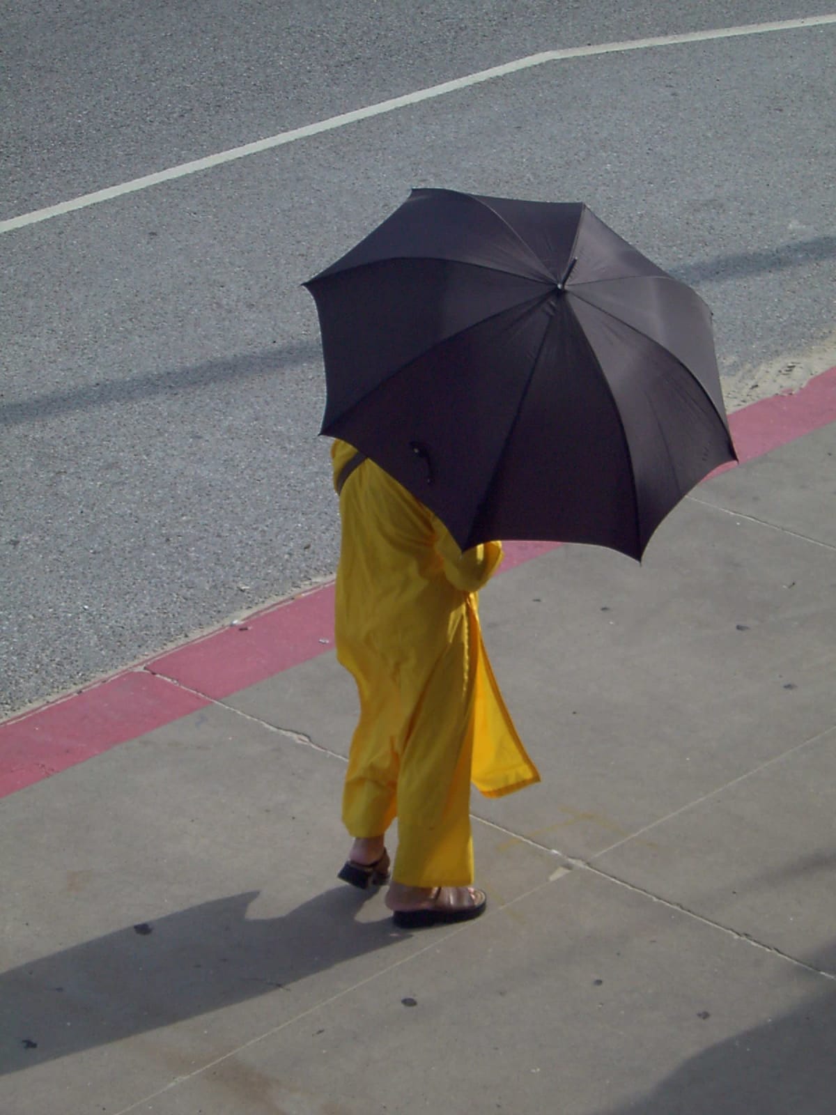Umbrella Woman, a portrait photograph by Bob McNeil