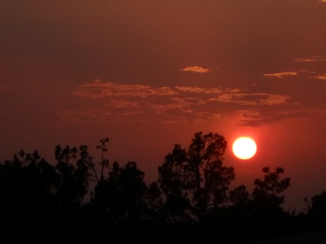 Sun 10, a sunrise and sunset photograph by Bob McNeil