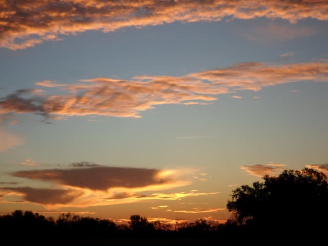 Sun 14, a sunrise and sunset photograph by Bob McNeil