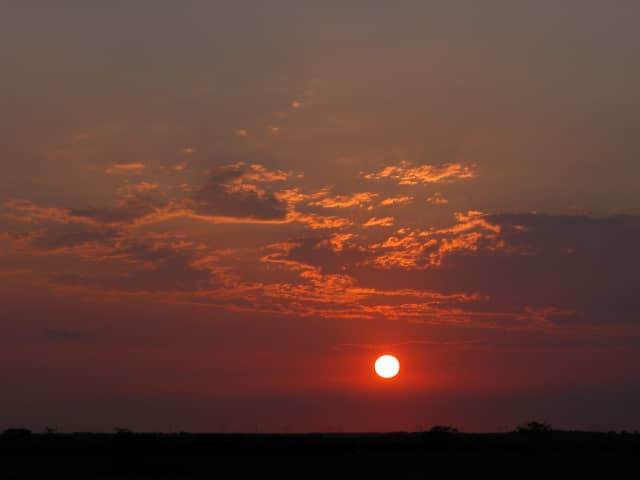 Sun 18, a sunrise and sunset photograph by Bob McNeil