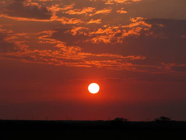 Sun 29, a sunrise and sunset photograph by Bob McNeil