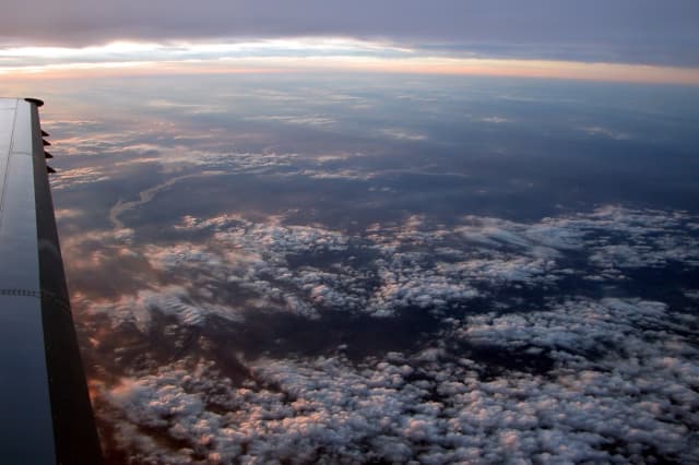 A Smooth Flight at Sunset, a aerial photograph by Bob McNeil